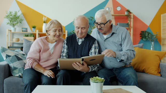 Elderly couple planning a gold IRA rollover with a precious metals specialist