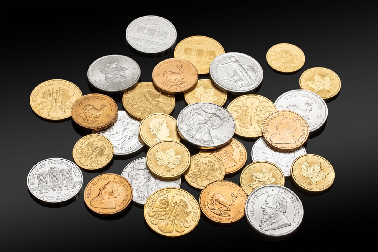 A pile of silver and gold coins