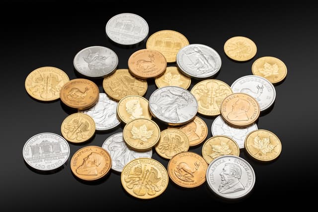 A pile of silver and gold coins