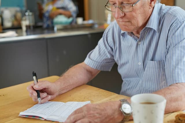 Elderly man deciding how much gold belongs in his retirement portfolio