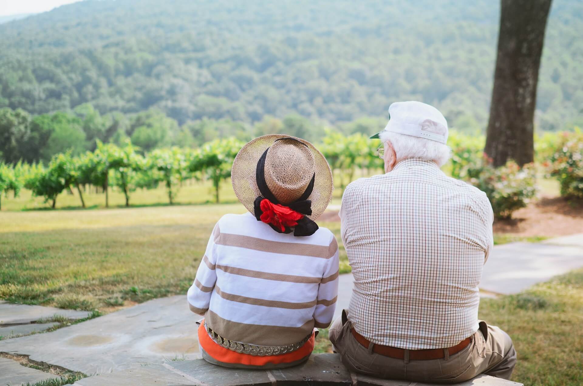 Elderly couple looking at their estate after a lifetime of building generational wealth