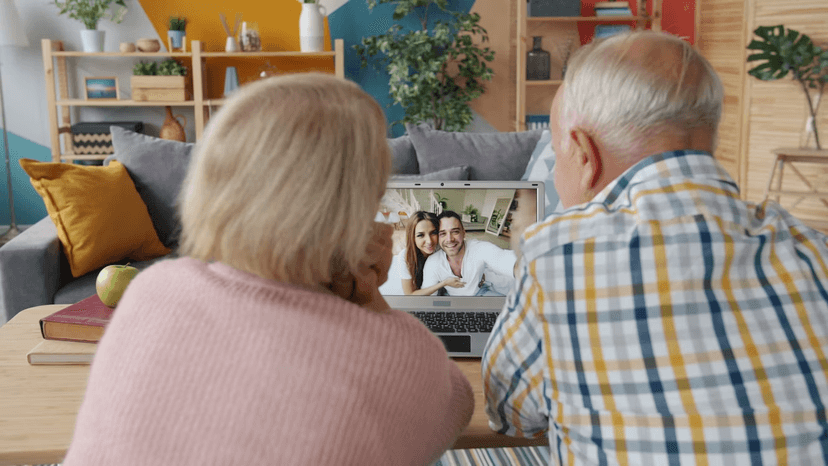 Elderly couple on a video call with their children