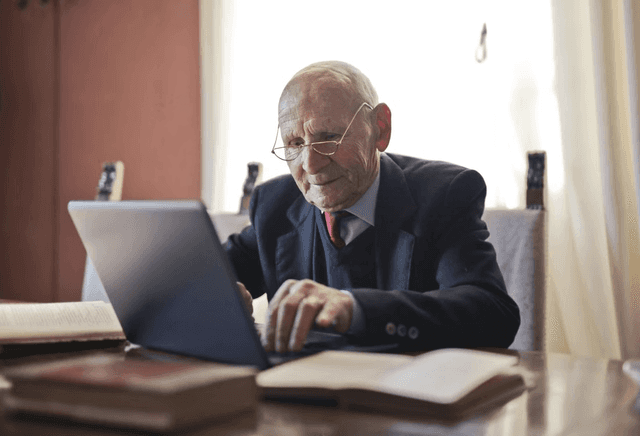 Elderly man researching asset ownership